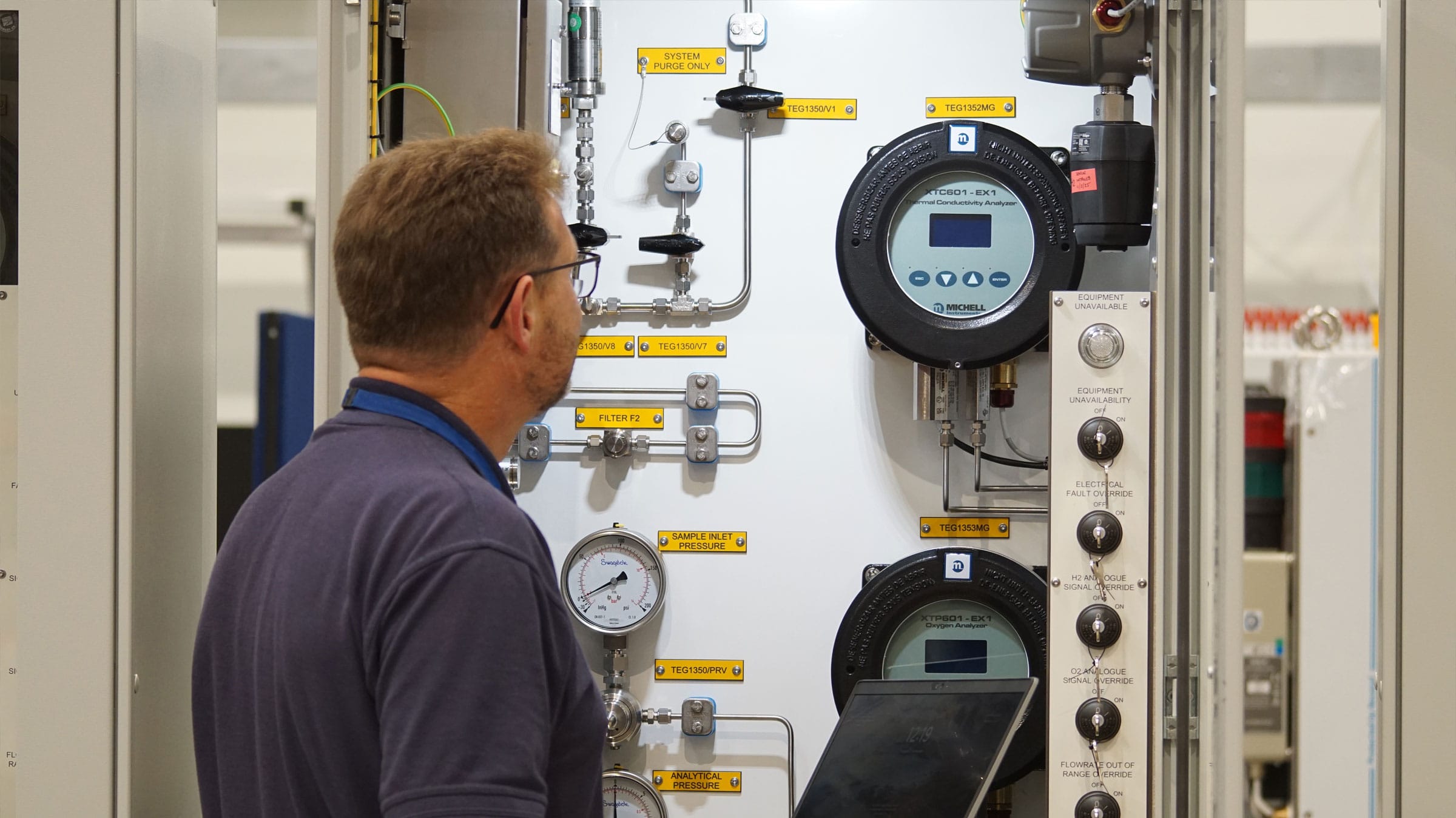 AMS employee looking into a panel system