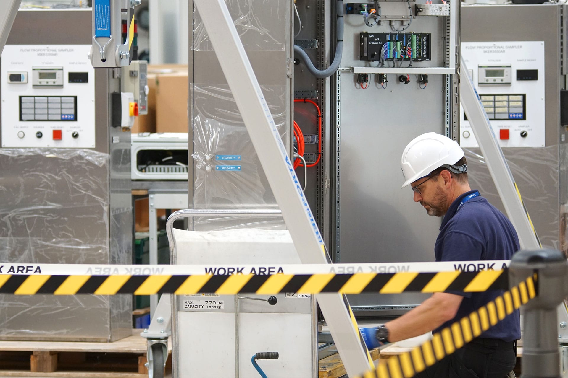 Engineer in made-safe environment, wearing PPE